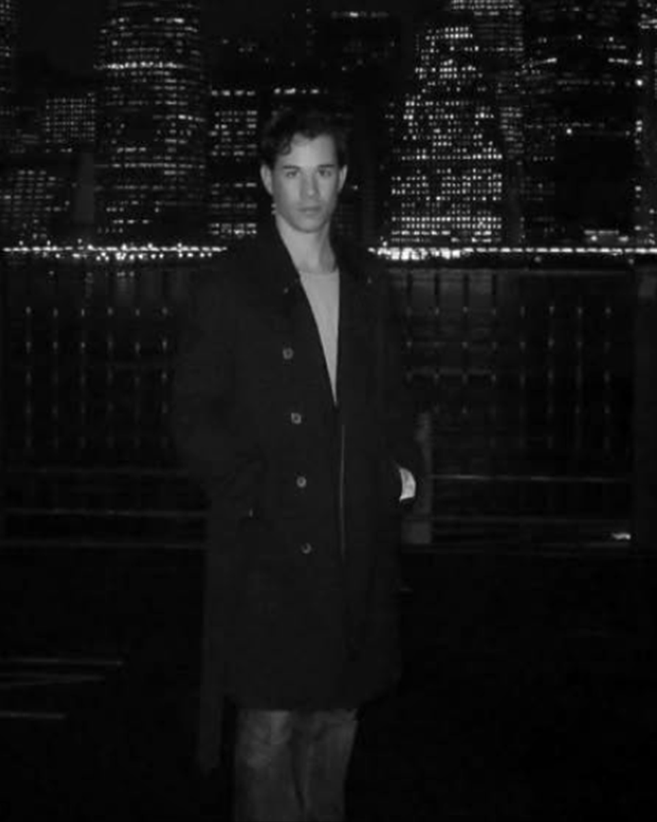 Author portrait of N. J. Renshaw by the New York skyline, in black and white